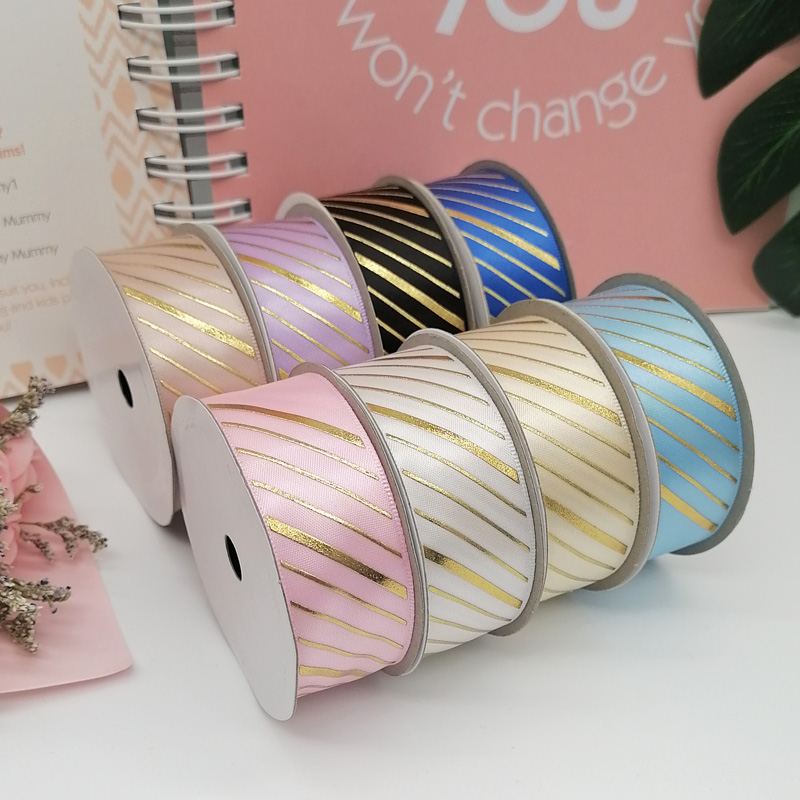 Satin ribbon with gold stripes